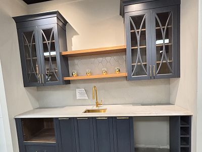 Wet bar: Blue, Counter top: 9 Ft.wide, 26’’deep, Retail value: $30,223.. Sale Price: $12,500 + Tax.. Includes: Cabinets, Quartz counter tops, Handles, Sink, Floating shelf’s, Cabinets accessories. Does not include: Removal from show room or  Installation. 